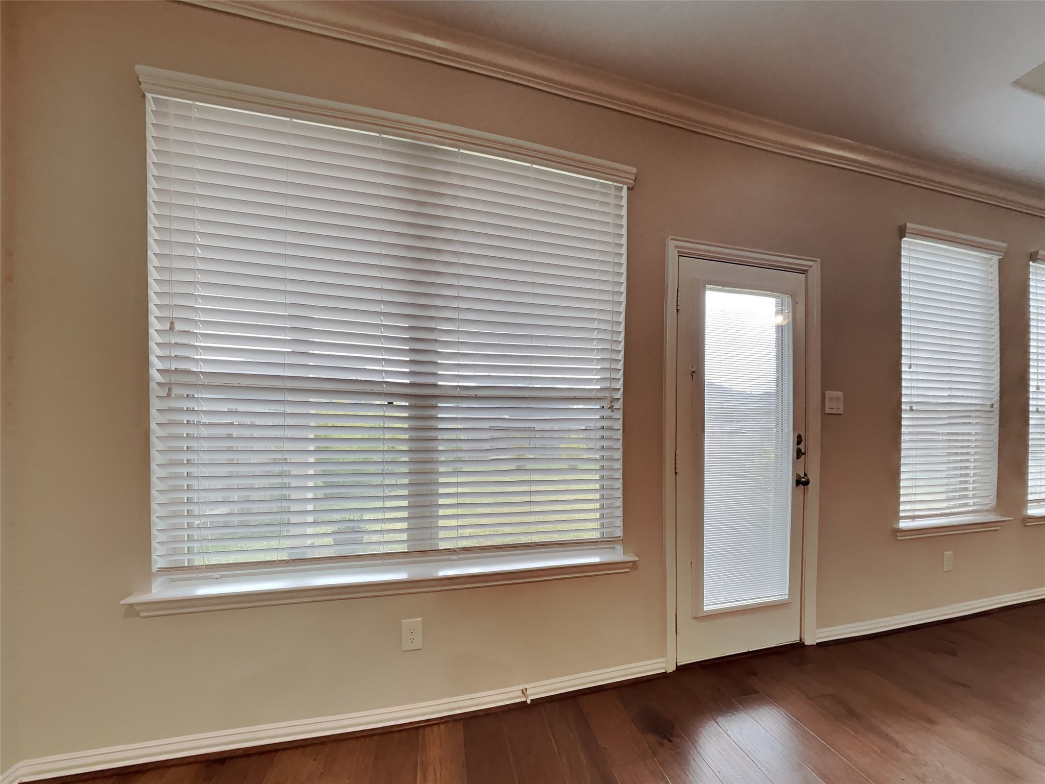 3434 Stablewood Grove Lane Spring, TX 77386 - Photo 6 of 22 an empty room with wooden floor and a window