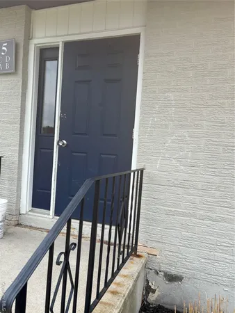 a view of entryway with a wooden door