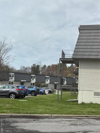 a view of a car park in front of the house