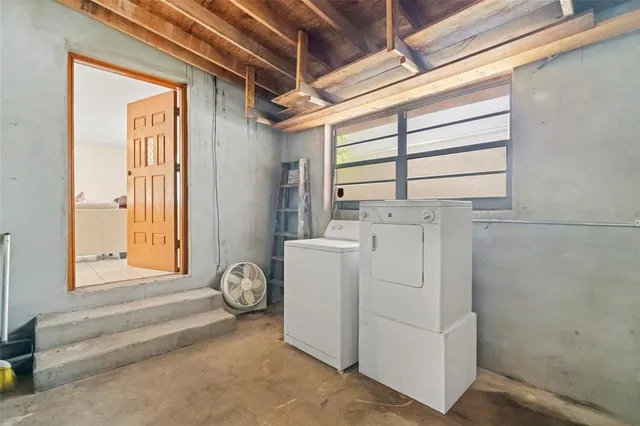 a spacious bathroom with a granite countertop sink and a mirror