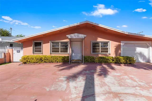 a view of a hallway with a chandelier fan