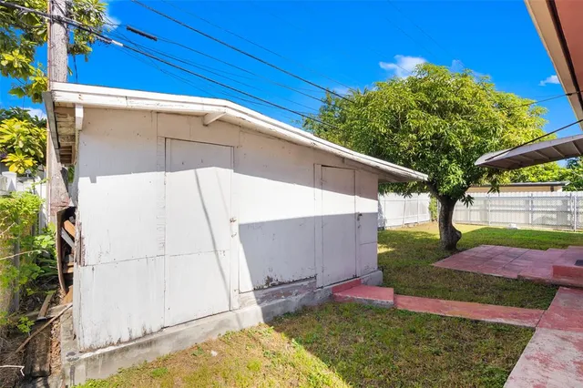 an aerial view of residential houses with yard