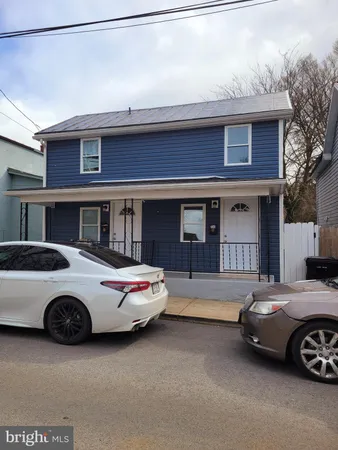 a car parked in front of a house