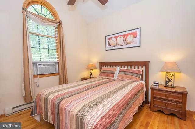 a bedroom with bed and a window