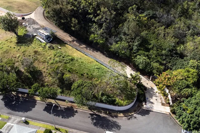 a view of a backyard with sitting area