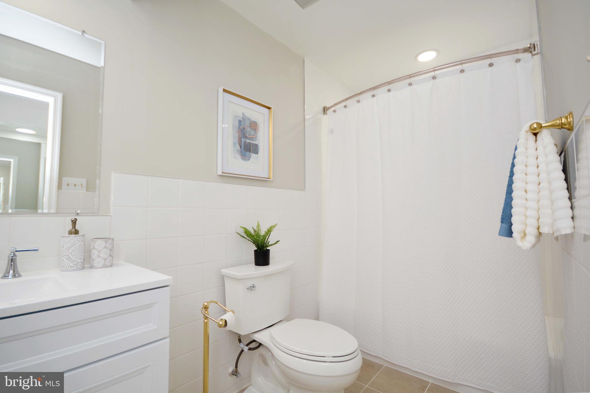 308 Pytchley Run Annapolis, MD 21403 - Photo 17 of 33 a white toilet sitting next to a bathroom sink