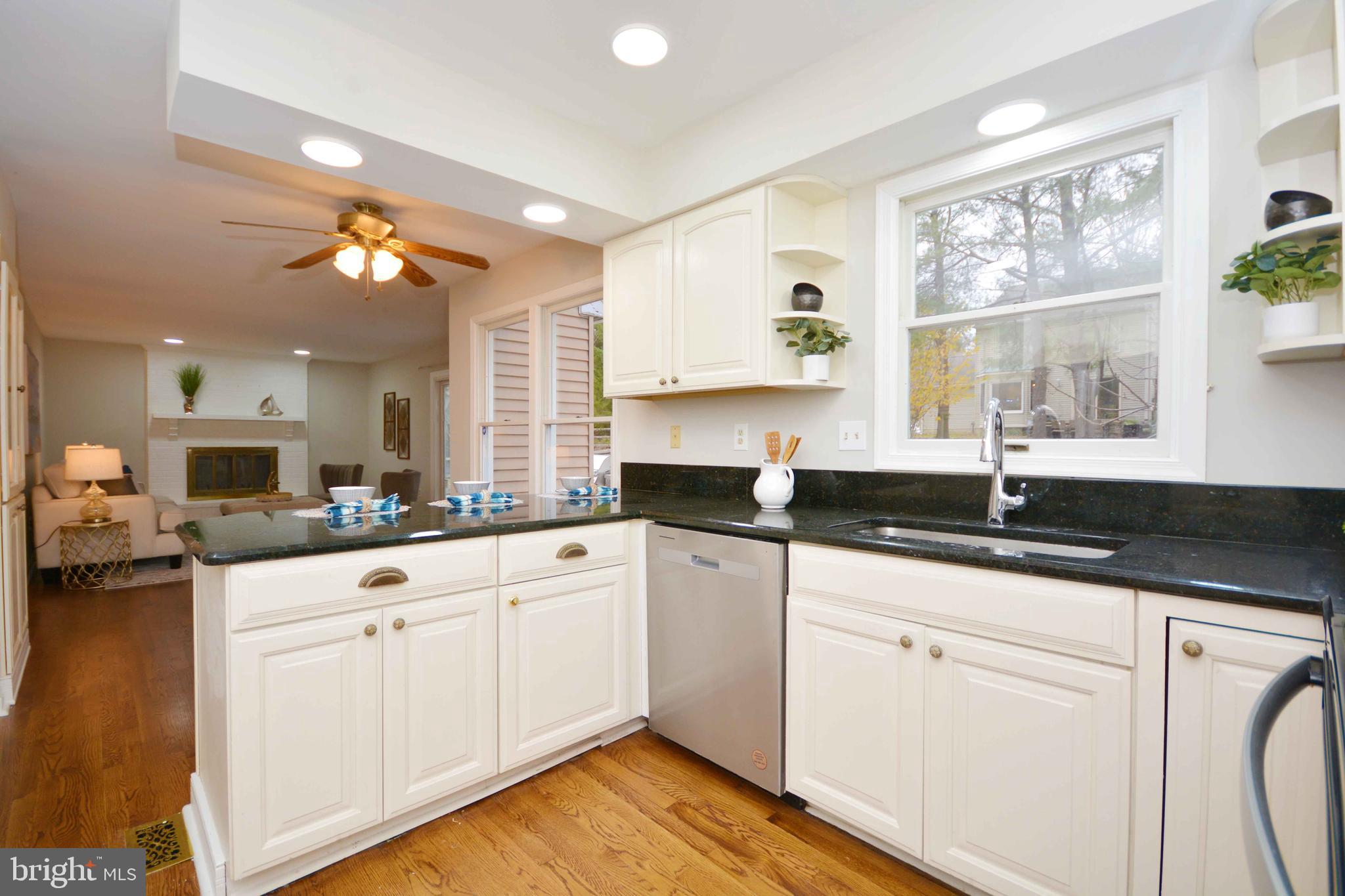 308 Pytchley Run Annapolis, MD 21403 - Photo 3 of 33 a kitchen with granite countertop white cabinets white appliances with a sink and a window