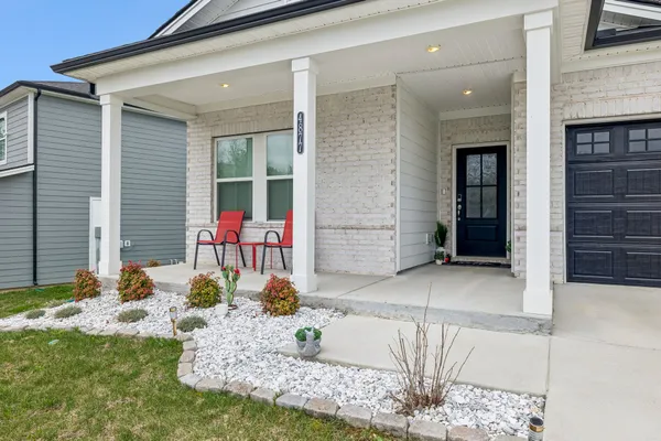 a front view of house with outdoor seating