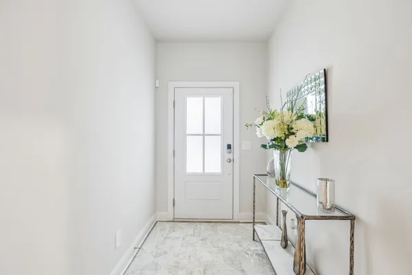 a view of entryway with wooden floor