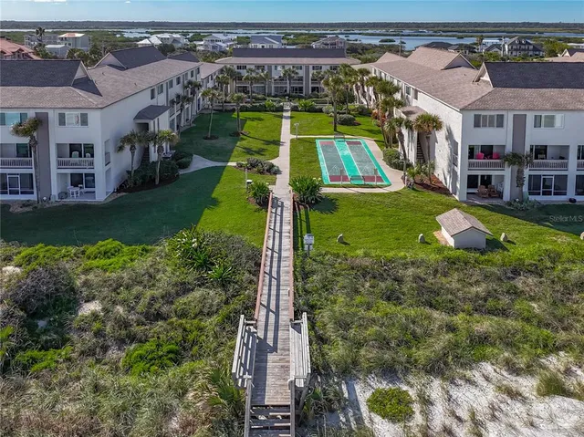 aerial view of a house with a yard