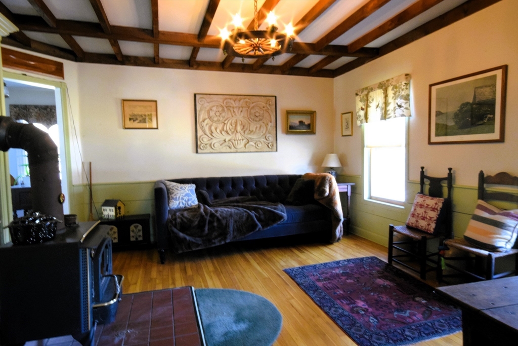 267 South Main Street Hopedale, MA 01747 - Photo 11 of 24 a living room with furniture wooden floor and a table