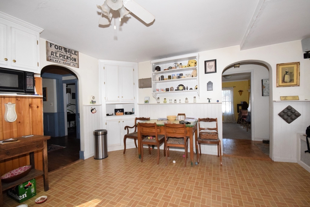 267 South Main Street Hopedale, MA 01747 - Photo 15 of 24 a living room with furniture a dining table and chairs with kitchen view