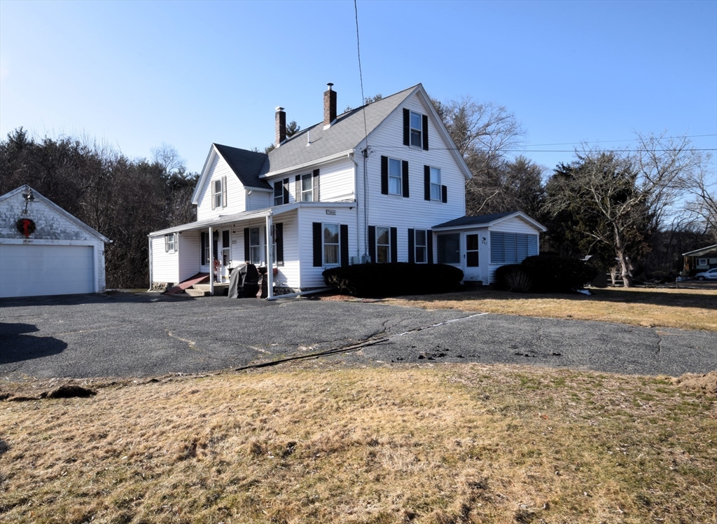 267 South Main Street Hopedale, MA 01747 - Photo 2 of 24 a front view of a house with a yard
