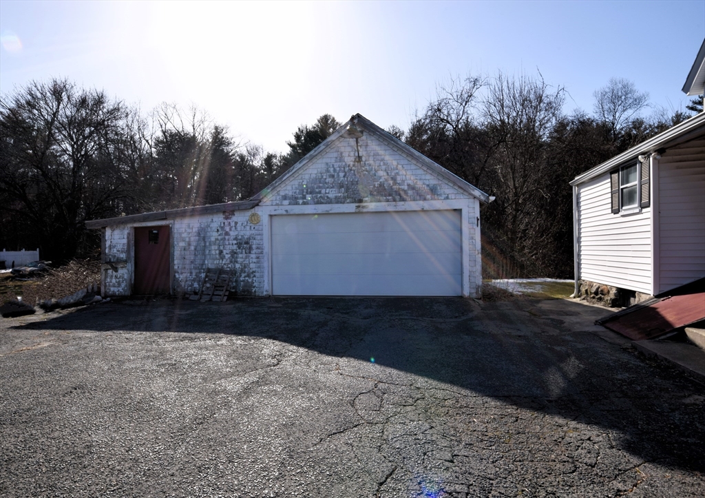 267 South Main Street Hopedale, MA 01747 - Photo 22 of 24 a front view of house with yard and trees around