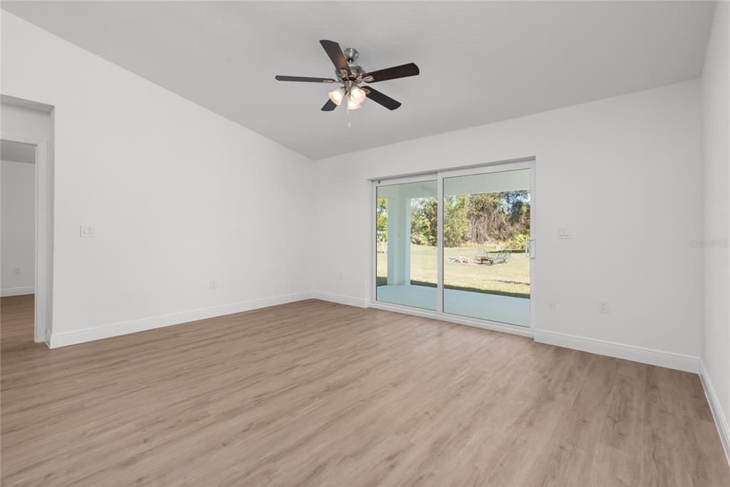 107 Blue Road Rotonda West, FL 33947 - Photo 10 of 11 a view of an empty room with a window
