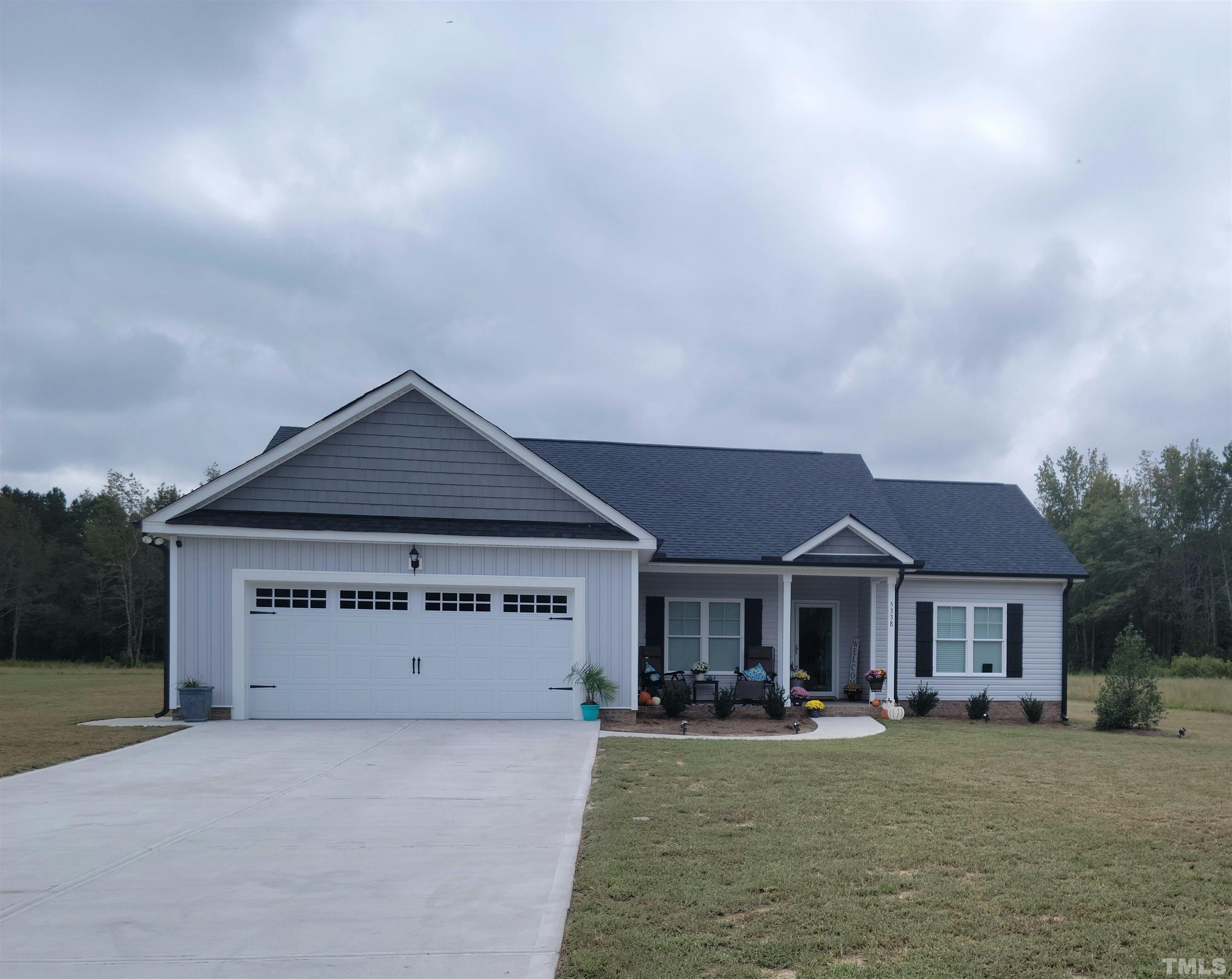 5338 Lloyd Road Lucama, NC 27851 - Photo 1 of 19 a front view of a house with yard porch and outdoor seating
