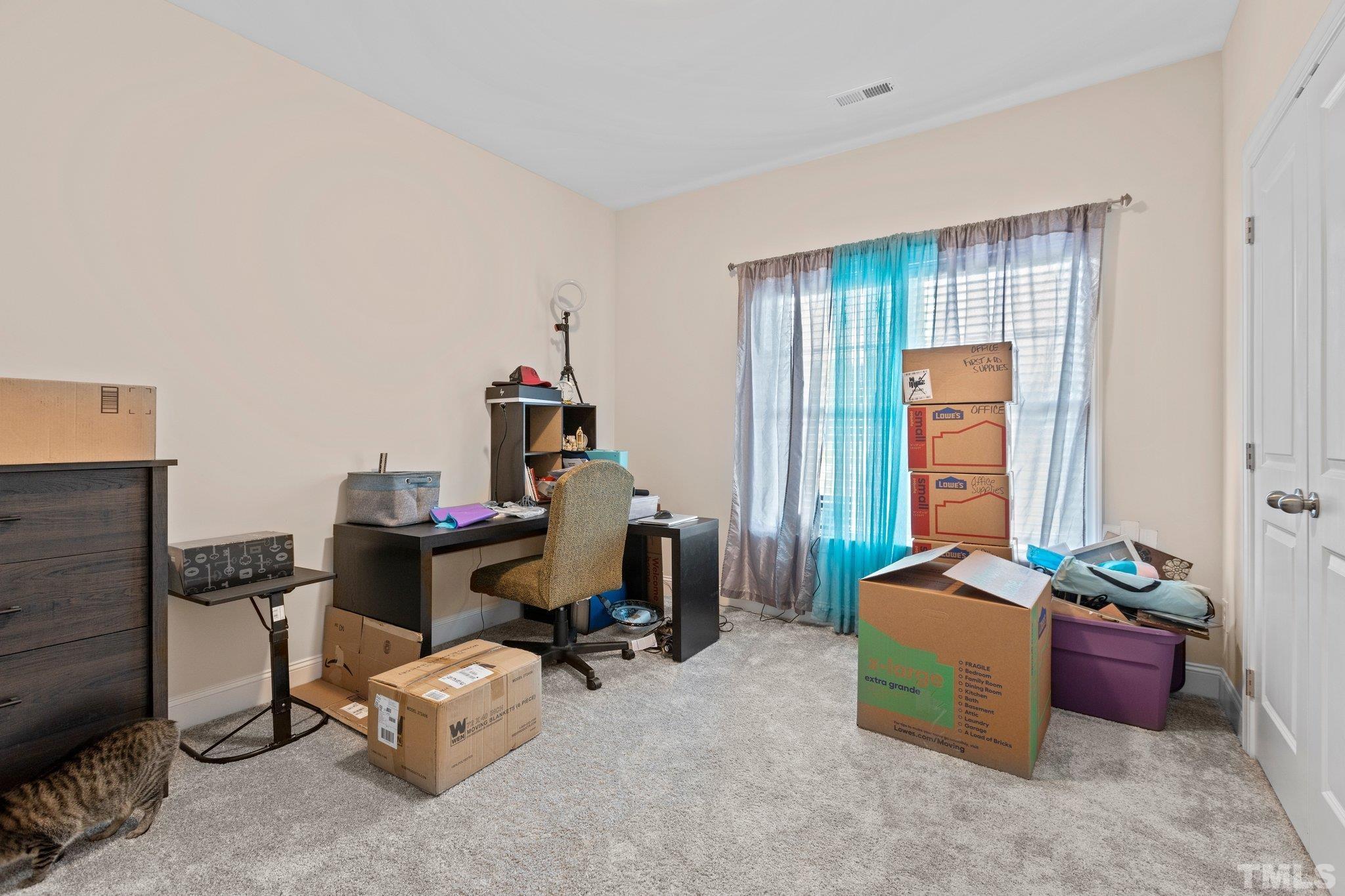 5338 Lloyd Road Lucama, NC 27851 - Photo 12 of 19 a view of a workspace with furniture and a window