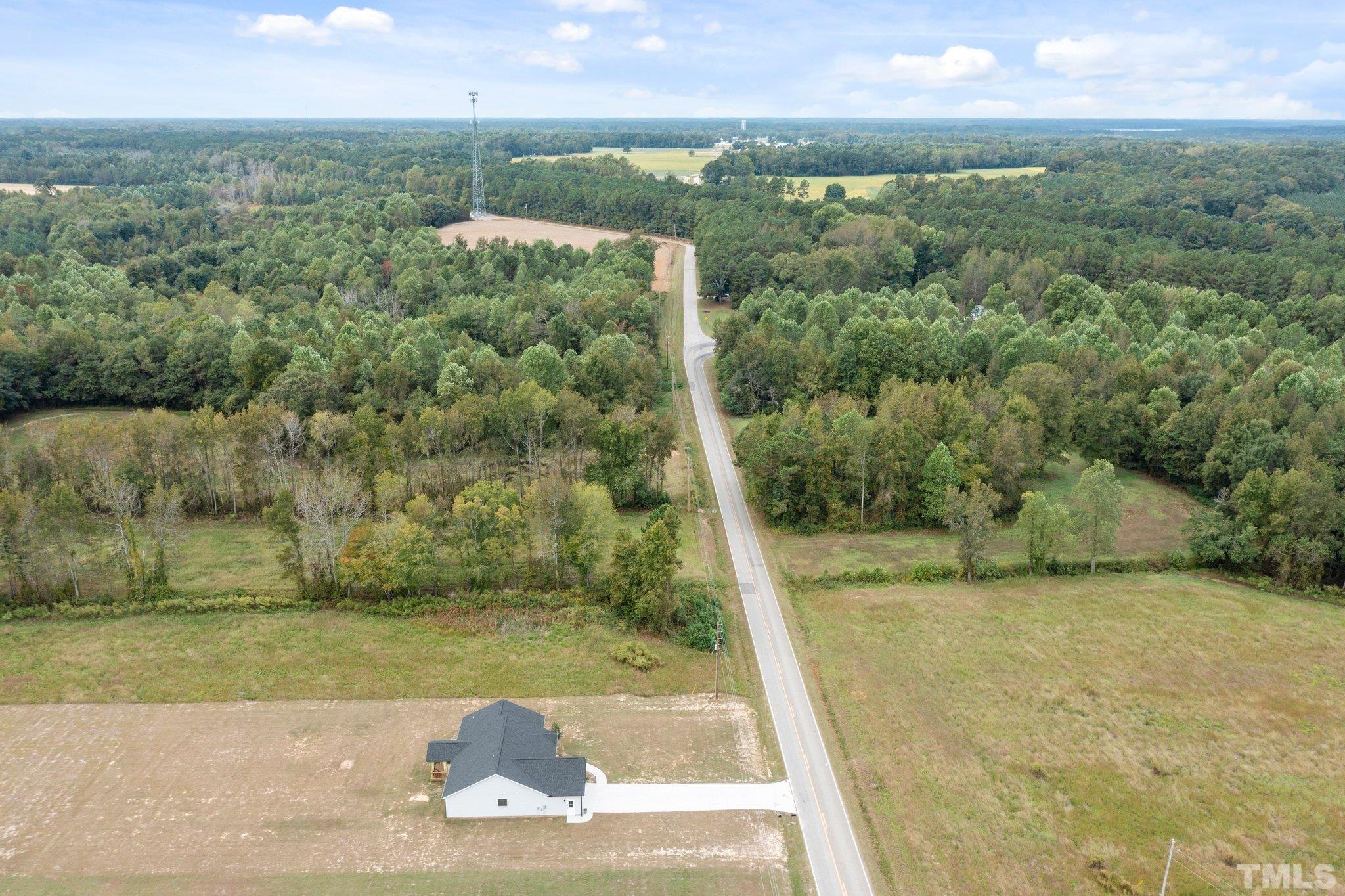5338 Lloyd Road Lucama, NC 27851 - Photo 5 of 19 a view of a yard with a bench