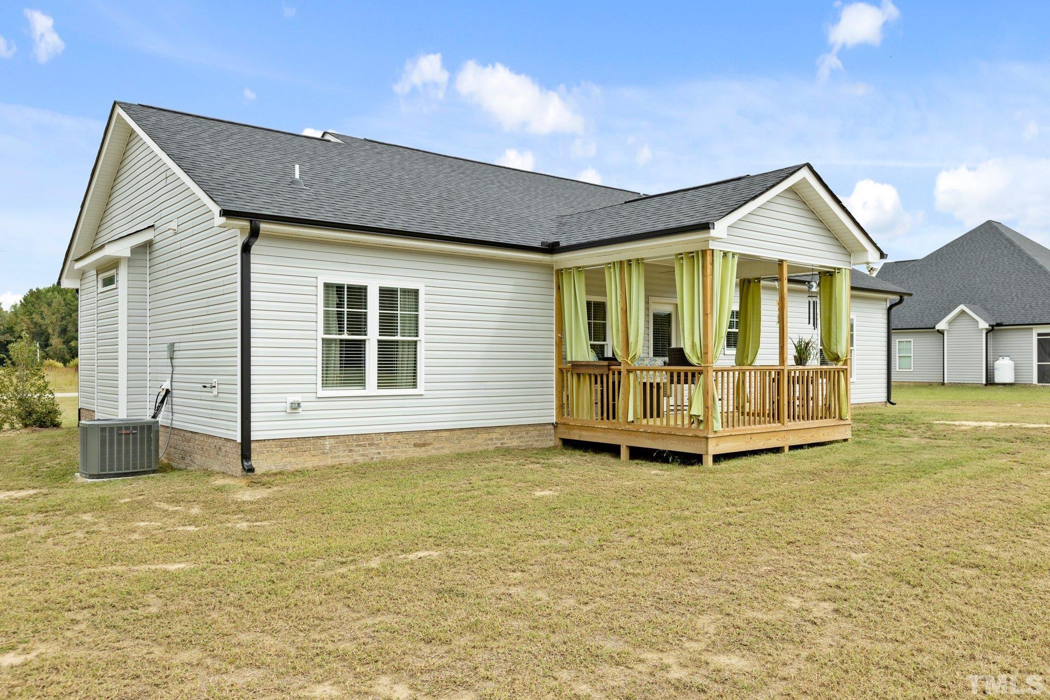 5338 Lloyd Road Lucama, NC 27851 - Photo 8 of 19 a view of a house with a yard and balcony