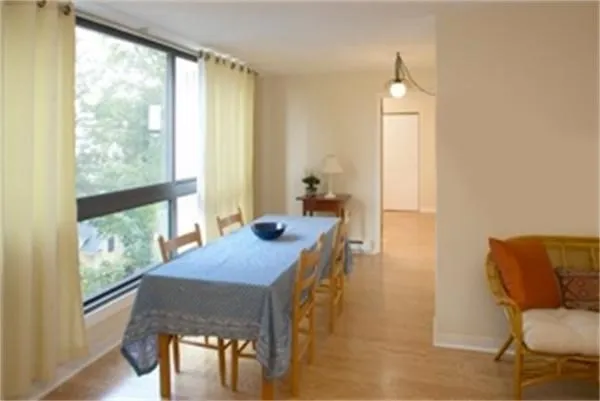 a view of a dining room with furniture and a window