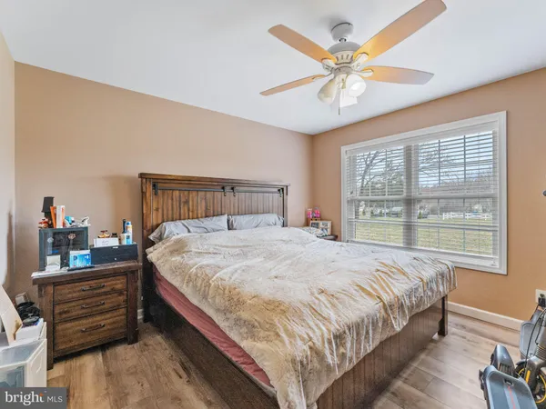a bed sitting in a bedroom next to a window