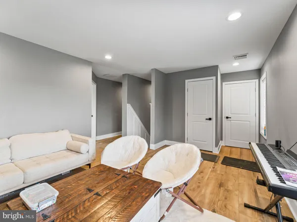 a bedroom with two beds and a couch