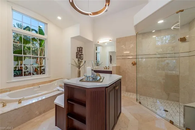 a bathroom with a sink double vanity and a shower