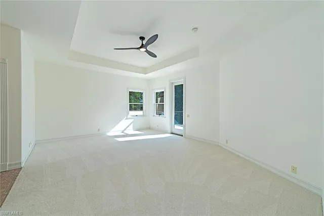 a view of empty room with ceiling fan