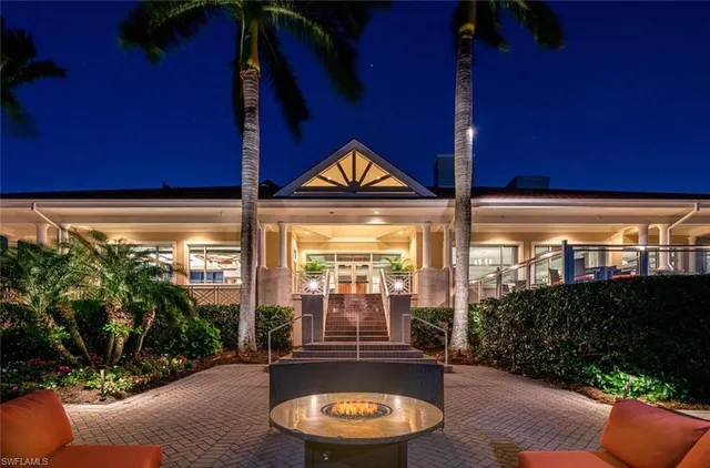 a view of a backyard with a sitting area