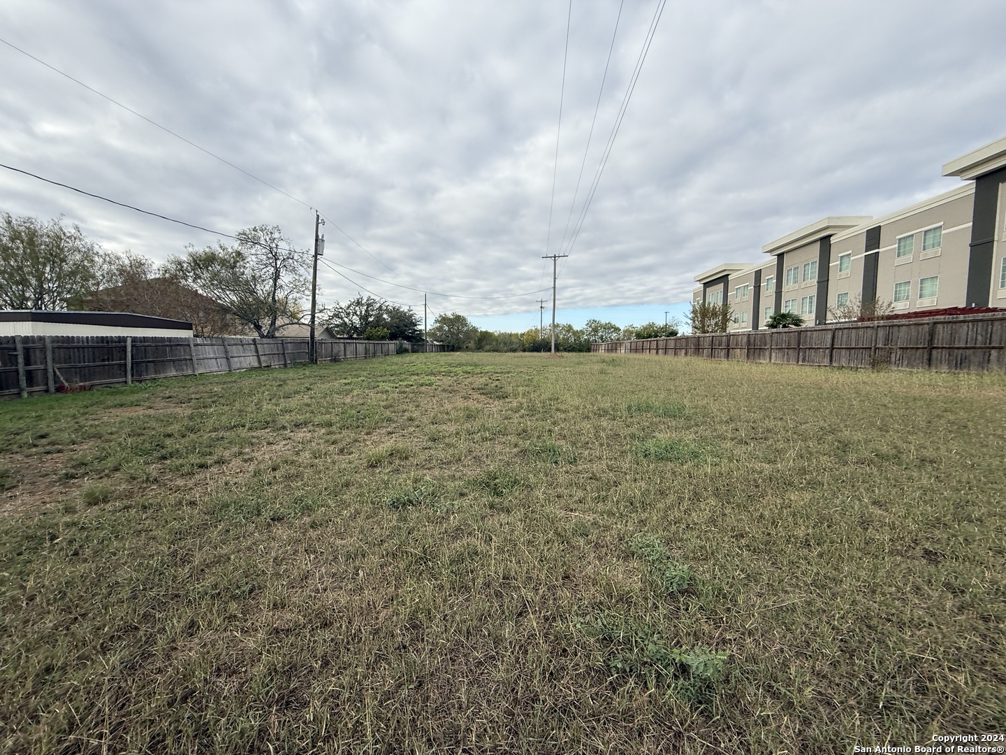 0 Bmt Drive Jourdanton, TX 78064 - Photo 8 of 9 a view of a house with a big yard