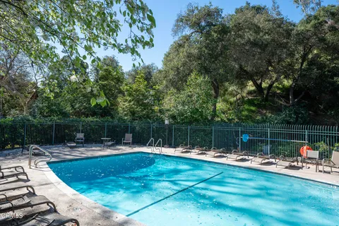 a swimming pool with view of lake