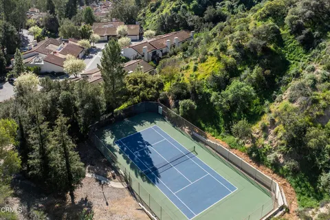 a view of house with a yard