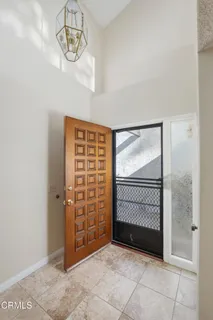 a view of an empty room with a staircase