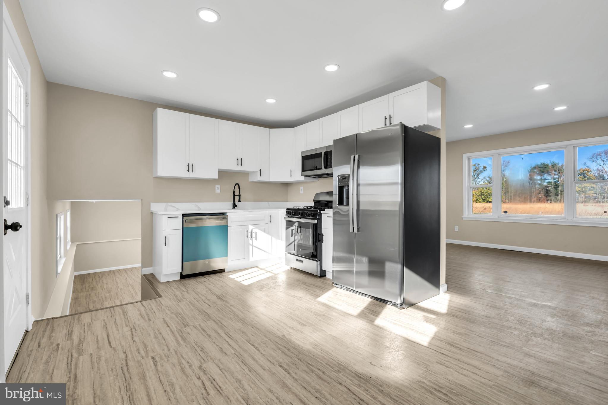 86 Scrapetown Road Pemberton, NJ 08068 - Photo 11 of 43 a kitchen with stainless steel appliances a refrigerator and a stove top oven