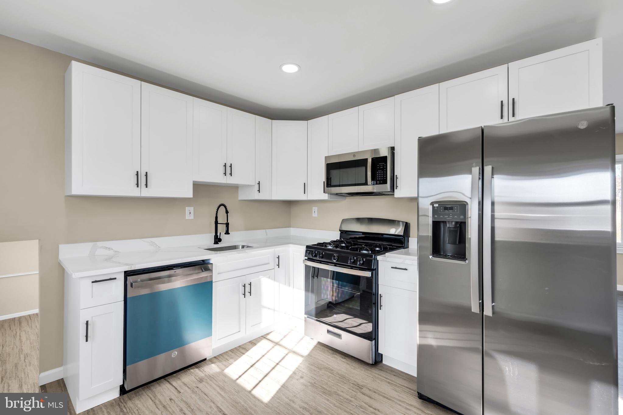 86 Scrapetown Road Pemberton, NJ 08068 - Photo 12 of 43 a kitchen with a refrigerator stove and microwave