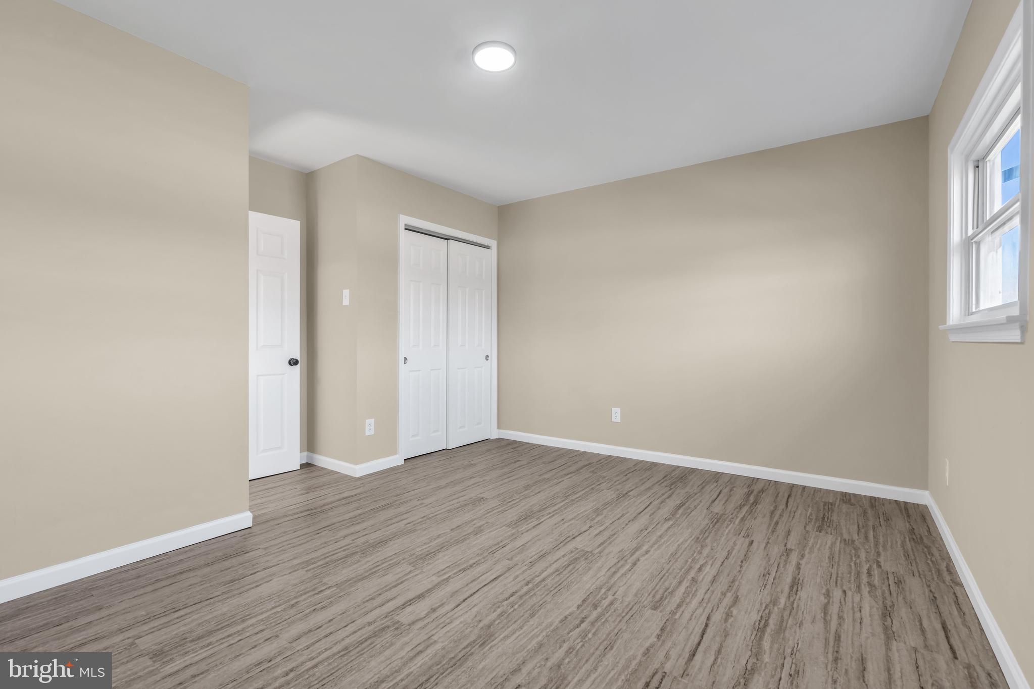 86 Scrapetown Road Pemberton, NJ 08068 - Photo 23 of 43 an empty room with wooden floor and windows