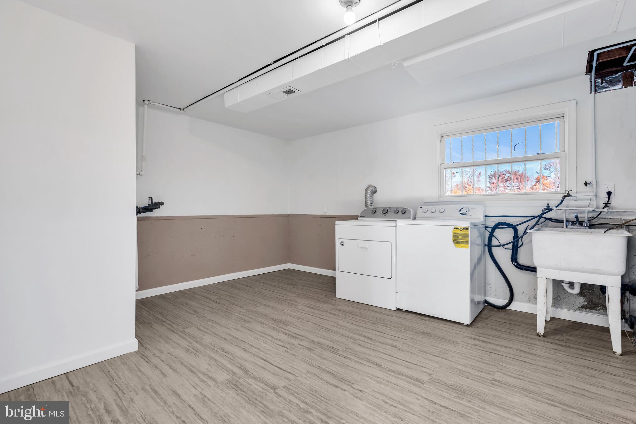 86 Scrapetown Road Pemberton, NJ 08068 - Photo 28 of 43 a utility room with cabinets dryer and washer