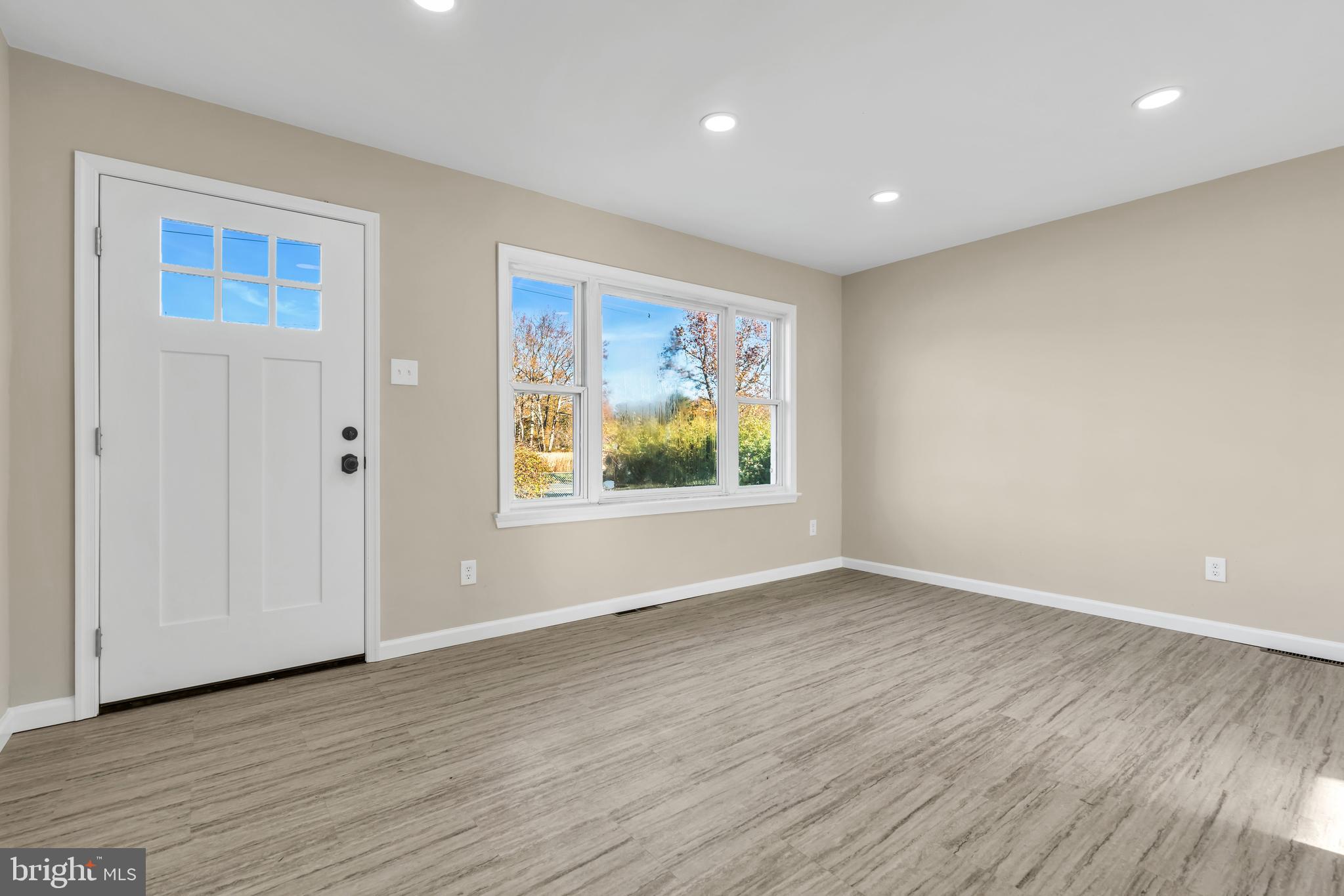86 Scrapetown Road Pemberton, NJ 08068 - Photo 6 of 43 a view of an empty room with wooden floor and window