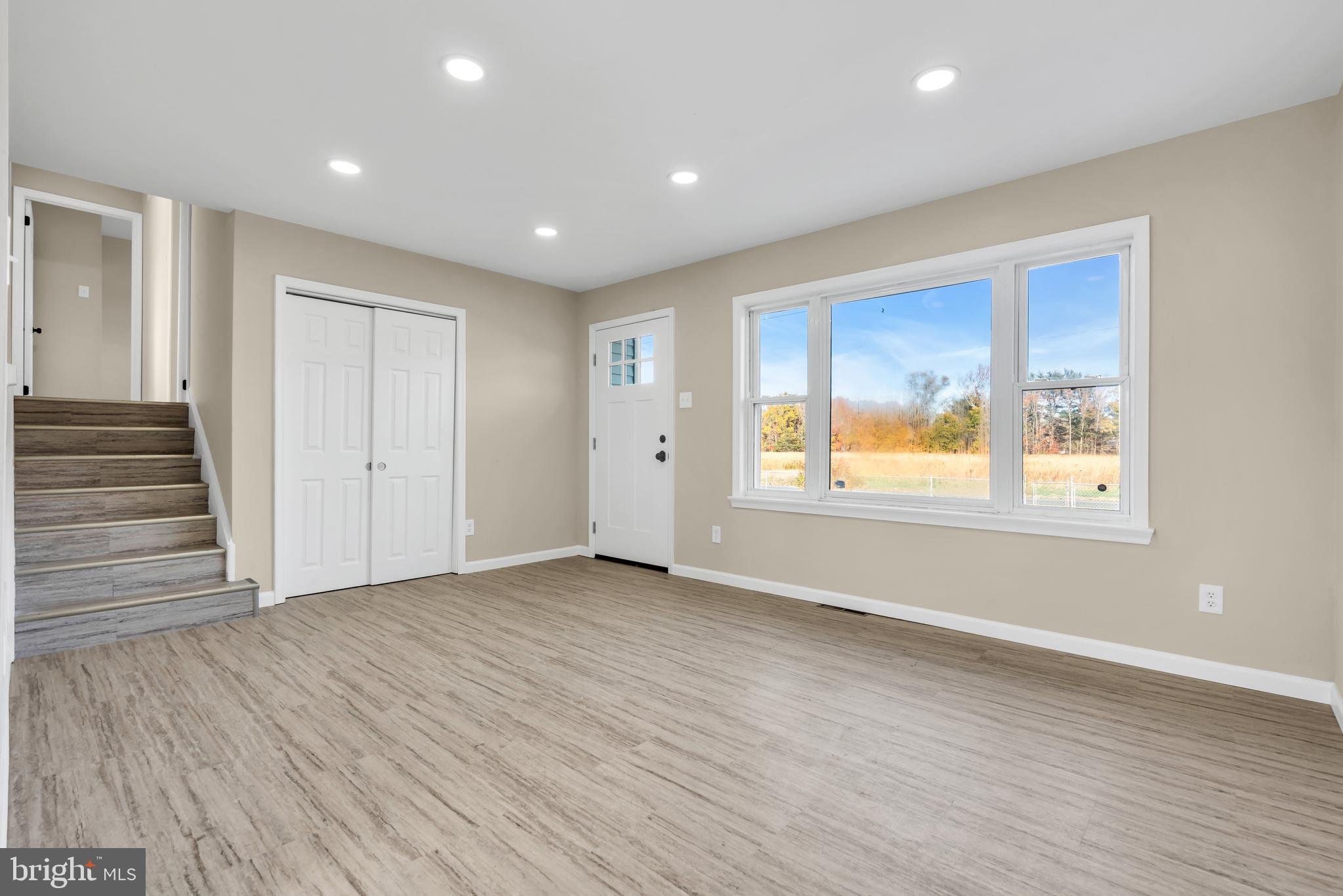 86 Scrapetown Road Pemberton, NJ 08068 - Photo 7 of 43 a view of an empty room with wooden floor and a window