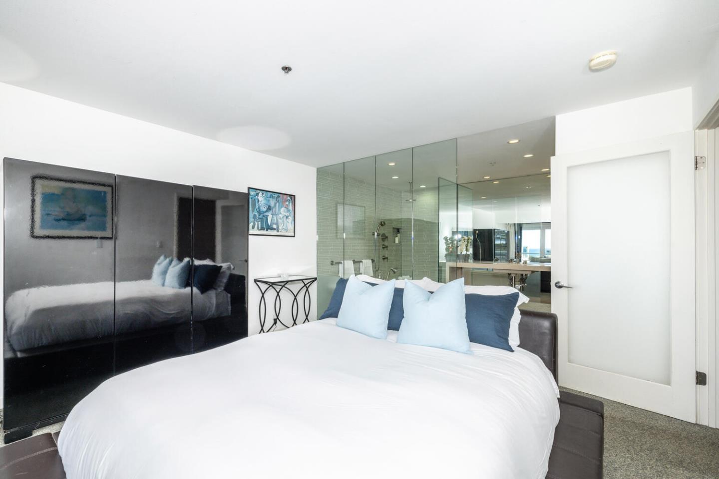 211 Roberts Road Pacifica, CA 94044 - Photo 11 of 42 a large bedroom with bed and wooden floor