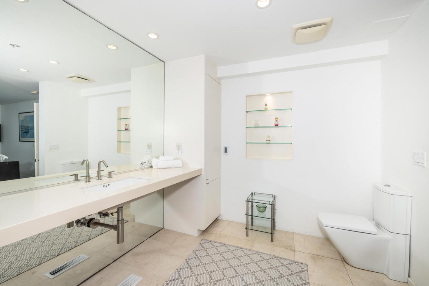 211 Roberts Road Pacifica, CA 94044 - Photo 15 of 42 a bathroom with a sink a toilet and a mirror