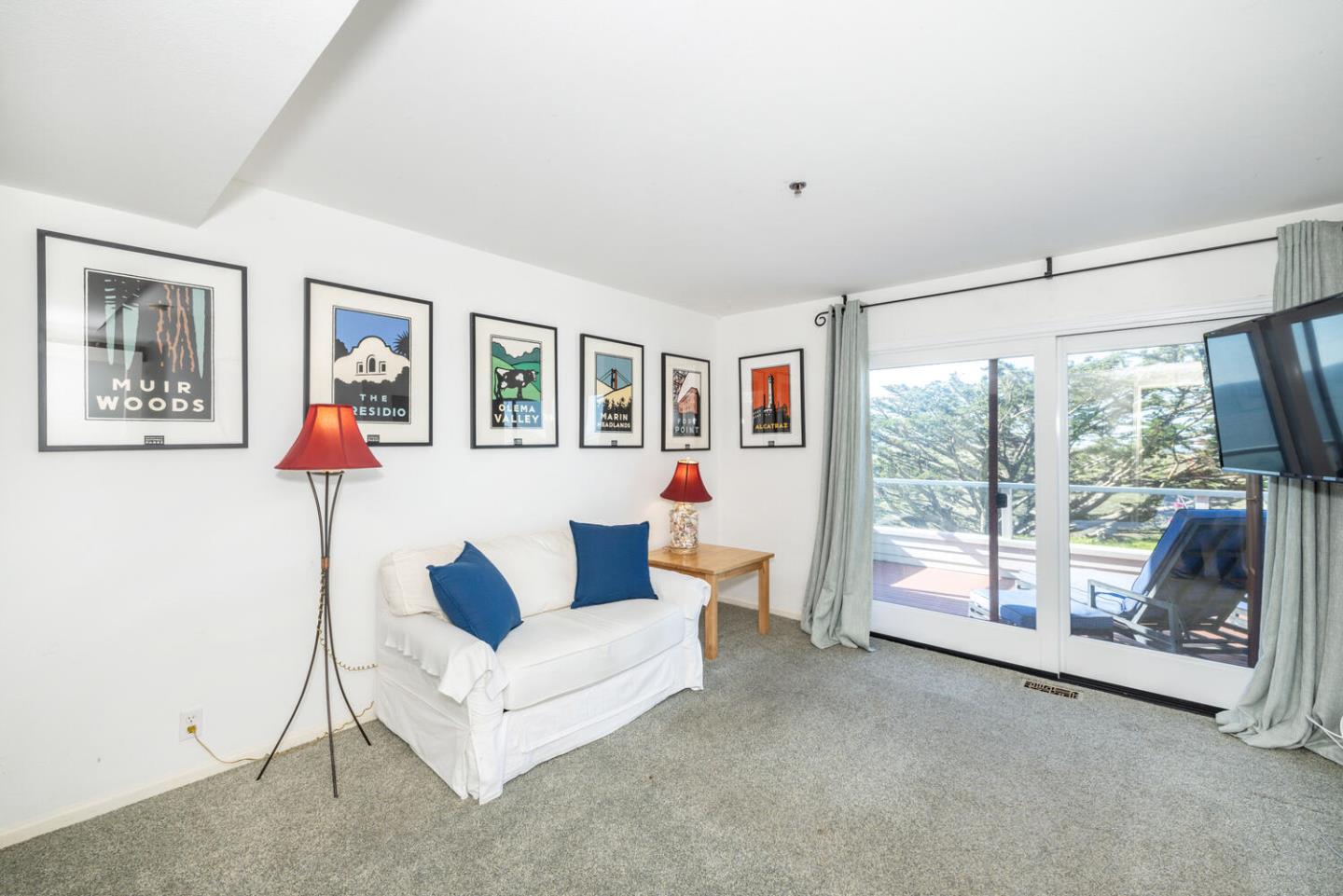 211 Roberts Road Pacifica, CA 94044 - Photo 16 of 42 a living room with furniture and a floor to ceiling window