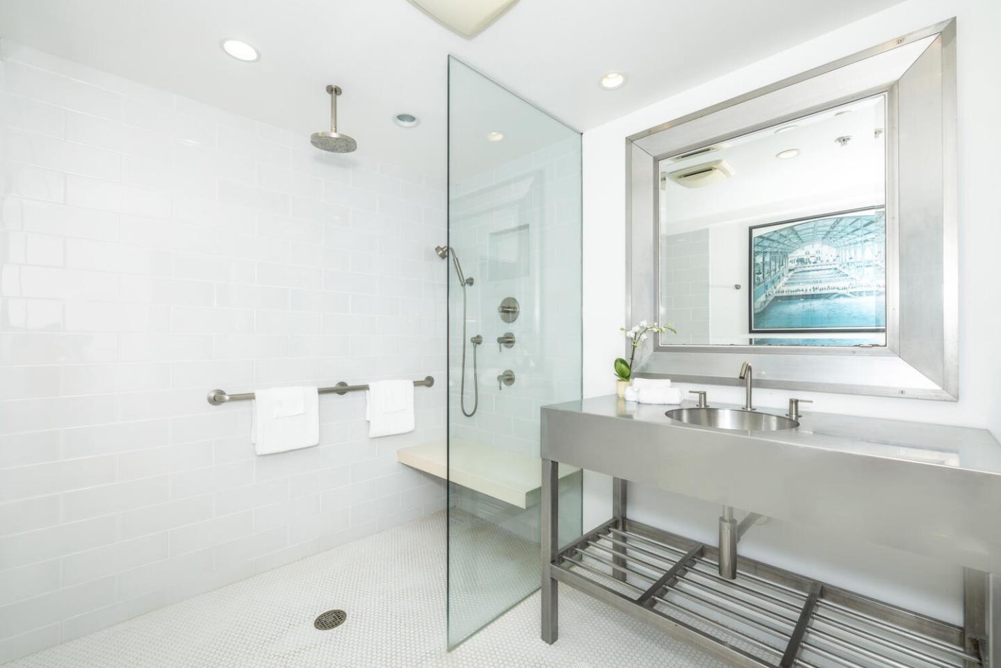 211 Roberts Road Pacifica, CA 94044 - Photo 18 of 42 a bathroom with a tub sink and mirror