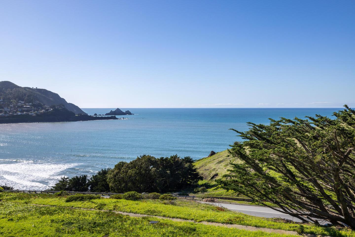 211 Roberts Road Pacifica, CA 94044 - Photo 2 of 42 a view of a lake with houses in the back