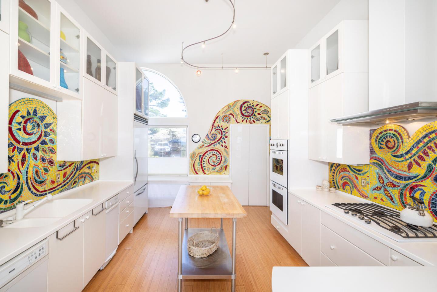 211 Roberts Road Pacifica, CA 94044 - Photo 25 of 42 a view of a kitchen with stainless steel appliances wooden floor and a refrigerator