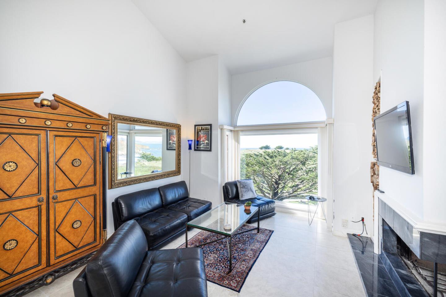211 Roberts Road Pacifica, CA 94044 - Photo 37 of 42 a living room with furniture a window and a flat screen tv