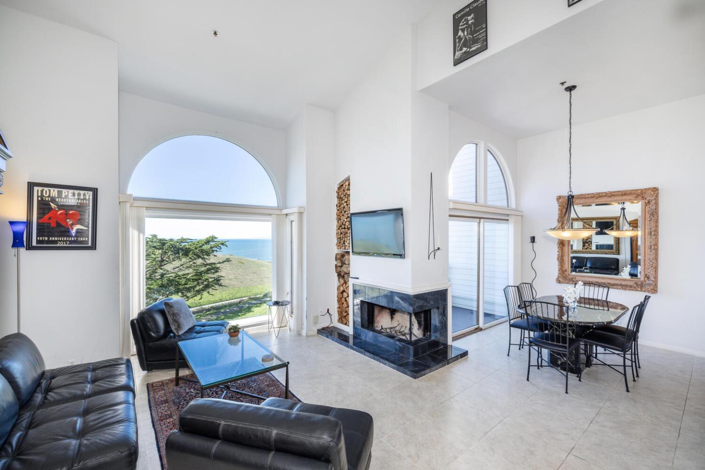 211 Roberts Road Pacifica, CA 94044 - Photo 38 of 42 a living room with furniture a fireplace and a large window