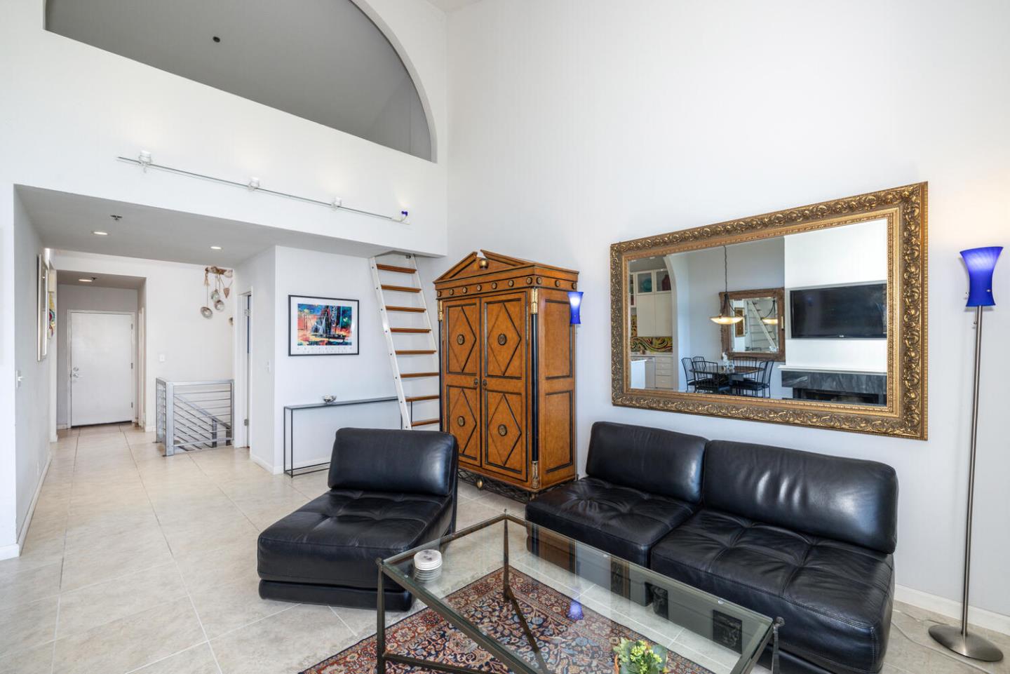211 Roberts Road Pacifica, CA 94044 - Photo 39 of 42 a living room with furniture and a flat screen tv