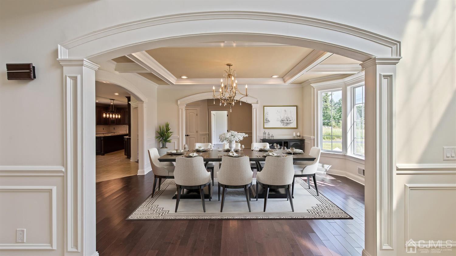 152 Culver Road Monmouth Junction, NJ 08852 - Photo 14 of 87 a dining room with wooden floor a chandelier a wooden table and chairs