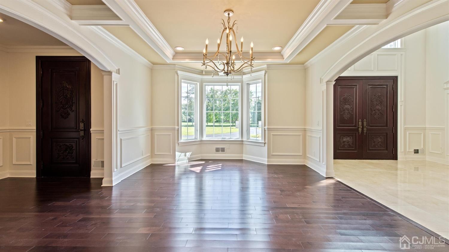 152 Culver Road Monmouth Junction, NJ 08852 - Photo 15 of 87 a view of an empty room with wooden floor and a window